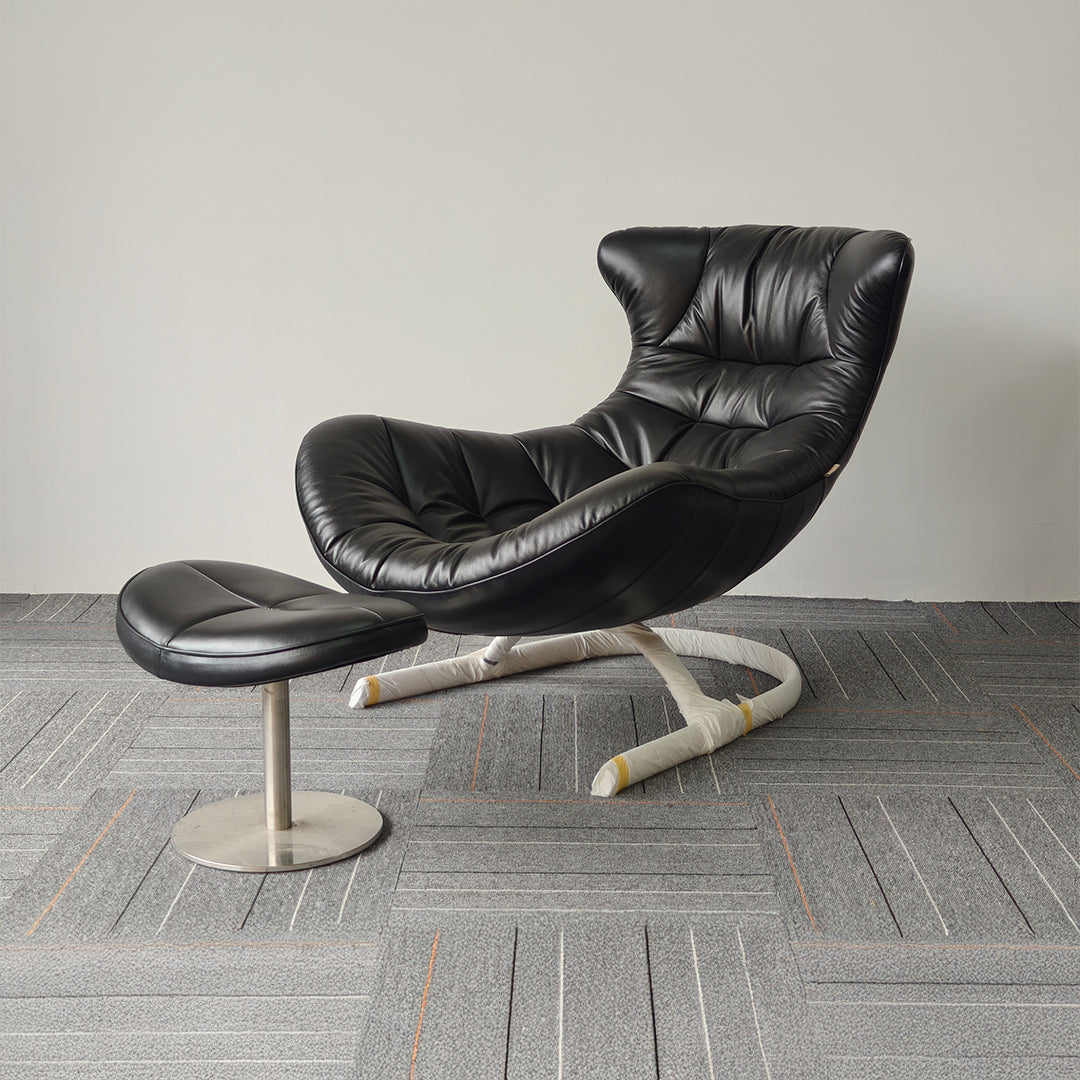 Vexel black lounge chair with matching ottoman by BEACON, modern design and comfortable seating for living room.