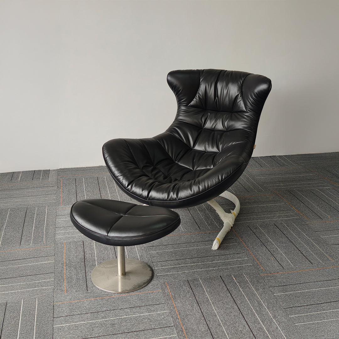 Vexel black lounge chair with matching ottoman by BEACON, modern design, upholstered seating and wooden legs.